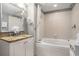 Bathroom featuring a vanity, mirror, and shower-tub combo with a shower curtain at 300 N Ocean Blvd. # 723, North Myrtle Beach, SC 29582