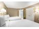 Spacious bedroom featuring two beds, a vanity mirror, and ample closet space at 300 N Ocean Blvd. # 723, North Myrtle Beach, SC 29582