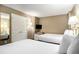 Comfortable bedroom featuring two beds, a TV, and coordinated decor at 300 N Ocean Blvd. # 723, North Myrtle Beach, SC 29582