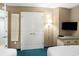 Comfortable bedroom featuring two beds, a TV, a full-length mirror and closet at 300 N Ocean Blvd. # 723, North Myrtle Beach, SC 29582