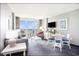 Cozy living room features modern decor and a calming color palette with ocean view balcony at 300 N Ocean Blvd. # 723, North Myrtle Beach, SC 29582