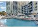 Resort pool and condo with lounge chairs surrounding the pool area at 300 N Ocean Blvd. # 723, North Myrtle Beach, SC 29582