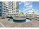 Modern pool with elevated water feature and lounge seating. Great place to relax at 300 N Ocean Blvd. # 723, North Myrtle Beach, SC 29582