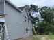 This two-story home features gray siding, white trim, and windows at 3038 Palma Way, Myrtle Beach, SC 29579