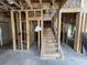 Image of an unfinished home's living room featuring the staircase and studs at 3038 Palma Way, Myrtle Beach, SC 29579