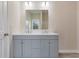 Bathroom featuring double sink vanity with a large mirror and neutral color walls at 306 S Magnolia Ave., Andrews, SC 29510