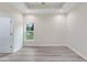 Bedroom with tray ceiling, neutral walls, natural light, and wood look floors at 306 S Magnolia Ave., Andrews, SC 29510