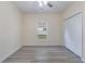 Cozy bedroom offers natural light from the window, ceiling fan, and closet at 306 S Magnolia Ave., Andrews, SC 29510