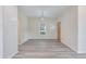 Modern dining room with light gray flooring, and natural light at 306 S Magnolia Ave., Andrews, SC 29510