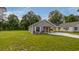 Inviting single-story home with a covered parking area and lush green lawn at 306 S Magnolia Ave., Andrews, SC 29510