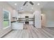 Bright and modern kitchen with white cabinets, stainless steel appliances, and sleek countertops at 306 S Magnolia Ave., Andrews, SC 29510