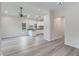Open-concept living area with modern floors flowing seamlessly into the kitchen space at 306 S Magnolia Ave., Andrews, SC 29510