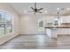 Bright and airy living room boasts contemporary flooring and ample natural light at 306 S Magnolia Ave., Andrews, SC 29510
