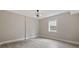 Neutral bedroom showcasing wood-look flooring and a modern ceiling fan with light at 3202 Inland St., North Myrtle Beach, SC 29582