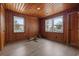 Bright bedroom with wood paneling, ceiling fan, and views of the outside at 3202 Inland St., North Myrtle Beach, SC 29582