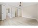 Bright and airy bedroom with three access doors, wood-look flooring, and modern ceiling fan at 3202 Inland St., North Myrtle Beach, SC 29582