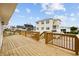 Beautiful wood deck featuring wood railings with views of neighboring homes and the surrounding area at 3202 Inland St., North Myrtle Beach, SC 29582