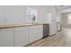 Charming kitchen features a stainless steel dishwasher, white cabinets and butcher block countertops at 3202 Inland St., North Myrtle Beach, SC 29582