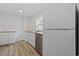 Bright kitchen features a stainless steel dishwasher, white cabinets, and butcher block countertops at 3202 Inland St., North Myrtle Beach, SC 29582