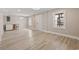 Bright living room with neutral walls, laminate flooring, and a front door at 3202 Inland St., North Myrtle Beach, SC 29582