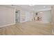 Bright living room with neutral walls, laminate flooring, and a closet at 3202 Inland St., North Myrtle Beach, SC 29582