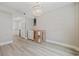 Bright living room with neutral walls, laminate flooring, and chandelier lighting at 3202 Inland St., North Myrtle Beach, SC 29582
