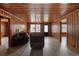 Classic living room with wood paneled walls, recessed lighting, and a comfortable seating area at 3202 Inland St., North Myrtle Beach, SC 29582