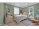 Guest bedroom with white furniture and bright, cheerful decor at 3231 Center Rd., Georgetown, SC 29440