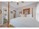 Cozy bedroom features a four-poster bed and an ensuite bathroom for added privacy at 3231 Center Rd., Georgetown, SC 29440