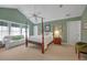 Bedroom with four-poster bed, sitting area, and neutral carpet for a calming space at 3231 Center Rd., Georgetown, SC 29440