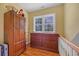 Upstairs hallway featuring hardwood floors and built-in storage at 3231 Center Rd., Georgetown, SC 29440