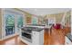 Bright, eat-in kitchen features stainless steel appliances, white cabinets, and access to the outdoor deck at 3231 Center Rd., Georgetown, SC 29440