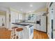 Bright kitchen with white cabinets, a breakfast bar, and stainless steel appliances at 3231 Center Rd., Georgetown, SC 29440