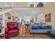 Cozy living room showcasing hardwood floors, fireplace, and an open floor plan to the kitchen at 3231 Center Rd., Georgetown, SC 29440