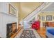 Spacious living room featuring a fireplace, staircase, and comfortable seating area at 3231 Center Rd., Georgetown, SC 29440