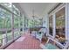 Relaxing screened porch with comfortable seating and outdoor views at 3231 Center Rd., Georgetown, SC 29440