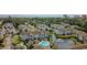 Aerial view of apartment complex featuring a pool, pond with fountain and lush green surroundings at 3774 Hitchcock Way # 836, Myrtle Beach, SC 29572