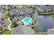 Aerial view of an apartment complex featuring a pool and a pond with a fountain at 3774 Hitchcock Way # 836, Myrtle Beach, SC 29572