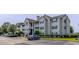 Apartment building exterior with landscaped grounds and parking at 3774 Hitchcock Way # 836, Myrtle Beach, SC 29572