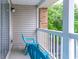 Balcony featuring blue Adirondack chairs, white railing and exterior brick at 3774 Hitchcock Way # 836, Myrtle Beach, SC 29572
