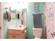 Bright bathroom with wood vanity, white sink, and decorated shower curtain at 3774 Hitchcock Way # 836, Myrtle Beach, SC 29572