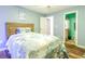 Light and airy bedroom with wood laminate flooring and adjoining bathroom at 3774 Hitchcock Way # 836, Myrtle Beach, SC 29572