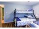 Bedroom with bunk bed, wood laminate flooring and natural light at 3774 Hitchcock Way # 836, Myrtle Beach, SC 29572