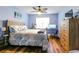 This bedroom features cool-toned walls, a ceiling fan and a window providing lots of natural light at 3774 Hitchcock Way # 836, Myrtle Beach, SC 29572