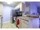 Efficient kitchen with stainless steel appliances, tile floor and stone countertops at 3774 Hitchcock Way # 836, Myrtle Beach, SC 29572