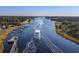 Aerial view of a waterway, lined with lush trees and vegetation at 3839 Woodridge Circle, Little River, SC 29566