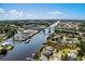 An aerial view showcasing the waterway, marina and bridges of this waterfront neighborhood at 3839 Woodridge Circle, Little River, SC 29566
