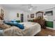 Bright bedroom features wooden floors, ceiling fan and well-appointed furniture at 3839 Woodridge Circle, Little River, SC 29566
