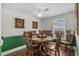 Cozy dining room featuring a round wood table with seating for six and decorative wall art at 3839 Woodridge Circle, Little River, SC 29566