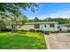 Charming single-story home featuring a well-manicured lawn, inviting porch, and a combination of siding and trim accents at 3839 Woodridge Circle, Little River, SC 29566